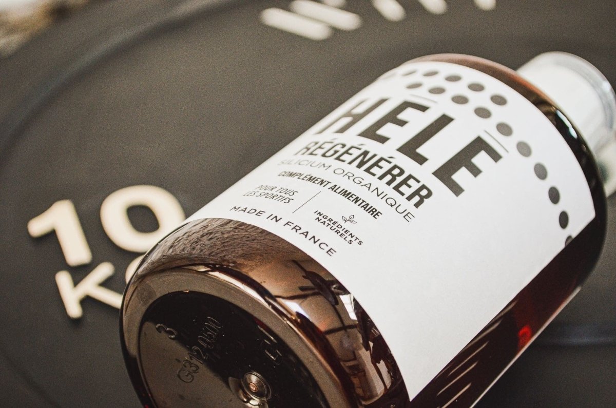 Gros plan sur un flacon de silicium organique Régénérer couché sur un poids de 10 kg